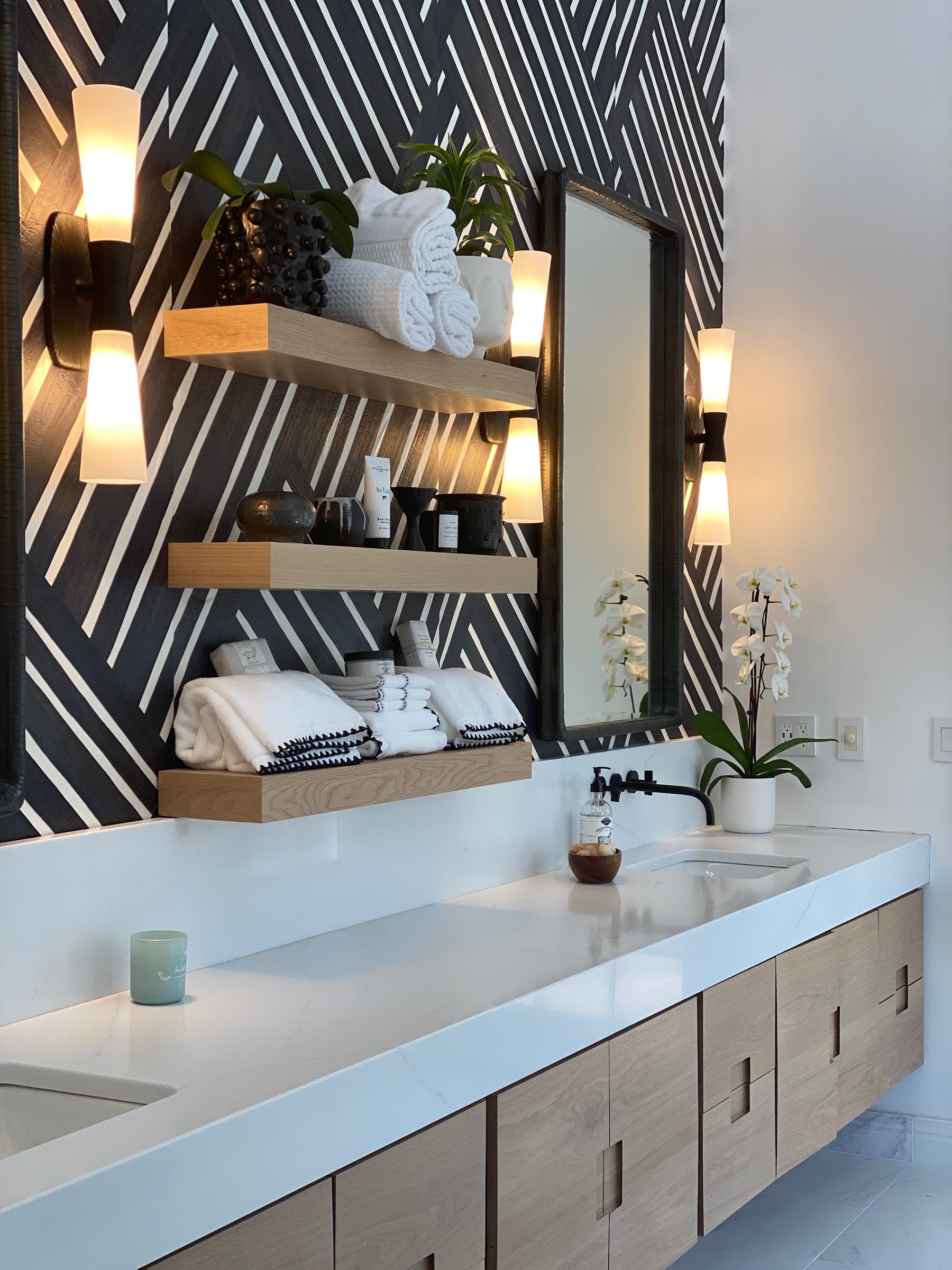 Powder room with a black and white chevron wall