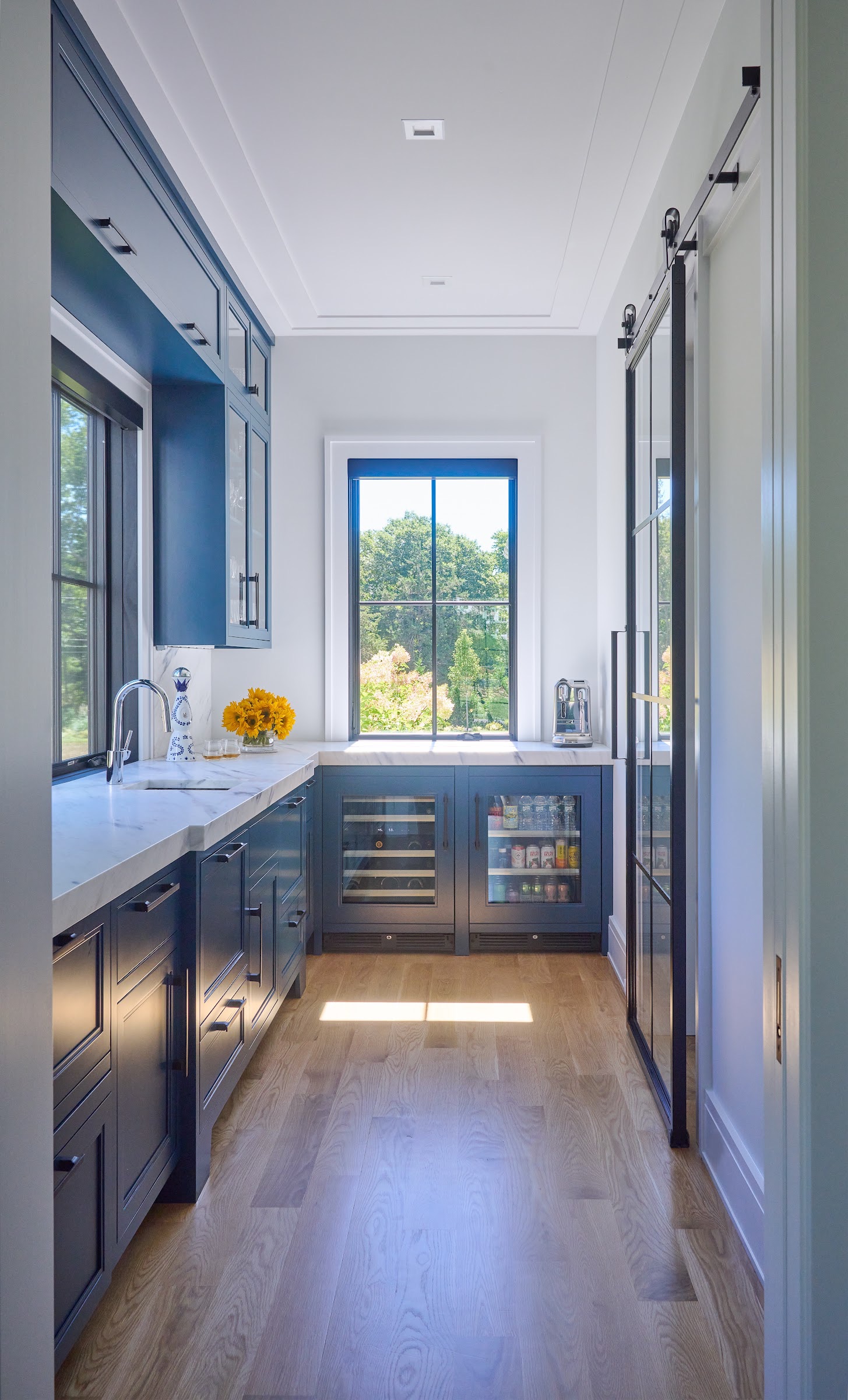 Scullery hallway with blue cabinetry